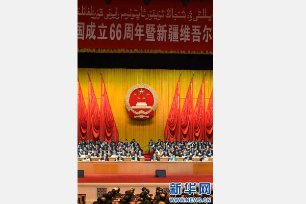 10月1日，慶祝中華人民共和國成立66周年暨新疆維吾爾自治區(qū)成立60周年大會在新疆人民會堂隆重舉行。 新華社記者 高潔 攝 